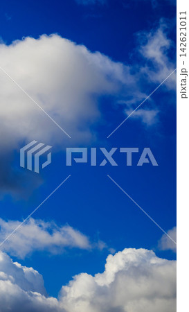 large white cloud in top part of blue sky large white cloud in top part of blue sky 142621011
