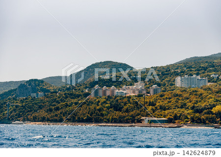 Yalta, Crimea, View cityscape panorama of city from Black Sea Yalta, Crimea, View cityscape panorama of city from Black Sea 142624879