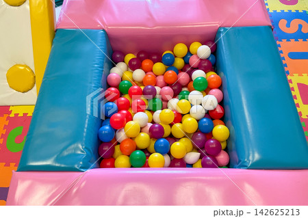 Playroom for preschool children, pool with colorful balls interior kindergarten Playroom for preschool children, pool with colorful balls interior kindergarten 142625213