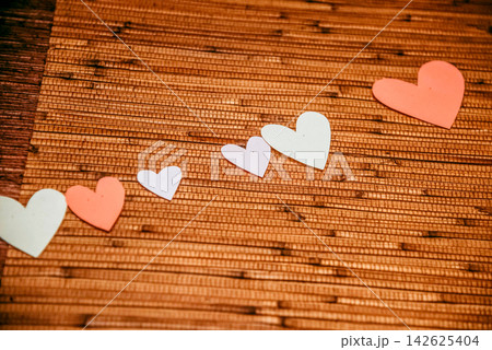 Festive decor for Valentine Day in interior romantic design with hearts card 142625404