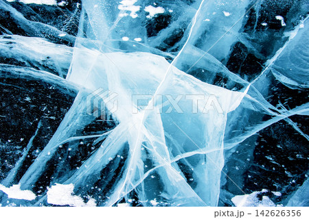 Deep blue ice texture lake Baikal water frozen winter, icy wallpaper background 142626356