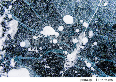 Deep blue ice texture lake Baikal water frozen winter, icy wallpaper background 142626360