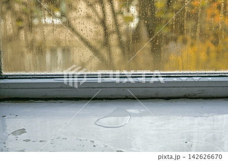 Glass covered with dense condensation inside room, Glass covered with dense condensation inside room, 142626670