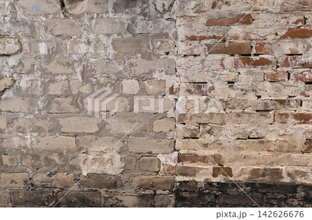 Brick wall with visible junction between different masonry styles and aged surfaces. Brick wall with visible junction between different masonry styles and aged surfaces. 142626676