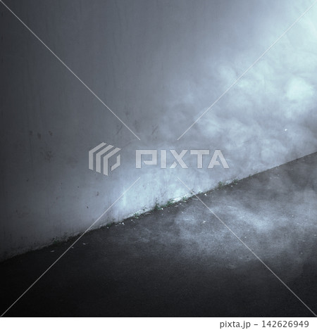 Cinematic and moody dark alleyway with thick fog and smoke illuminated by a cool blue light source against a concrete wall. Smoke background Cinematic and moody dark alleyway with thick fog and smoke illuminated by a cool blue light source against a concrete wall. Smoke background 142626949