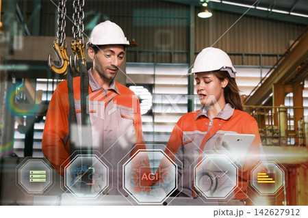 The engineer checks the parts coming out of the machine. 142627912
