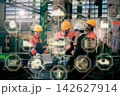 The engineer checks the parts coming out of the machine. 142627914
