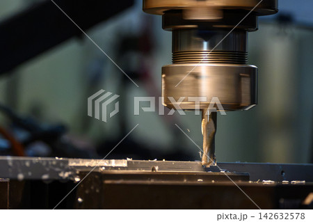 Slot cutting operation on an aluminum plate using a flat nose end mill tool on a milling machine 142632578