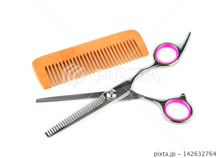 Hair Thinning Scissors and Wooden Comb Isolated on White Background Hair Thinning Scissors and Wooden Comb Isolated on White Background 142632764