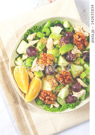 Fresh Waldorf salad, celery stalk with chicken, apple and walnuts, grapes, herbs, homemade, without people, Fresh Waldorf salad, celery stalk with chicken, apple and walnuts, grapes, herbs, homemade, without people, 142635834
