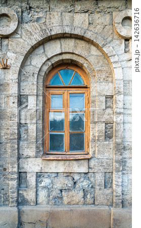 The window of the old mansion 19 century with brown bricks wall 142636716