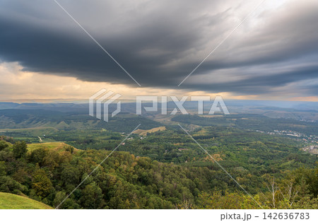 Layers of green mountains and hills in the haze during sunset. Panoramic View of Green hills and Meadow. Layers of green mountains and hills in the haze during sunset. Panoramic View of Green hills and Meadow. 142636783