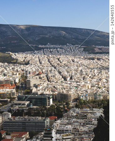 Athens, Attica, Greece, beautiful panoramic view of Athens cityscape, with The Parthenon, mountains, sea and scenery beyond the city, seen from Mount Lycabettus Hill observation deck in a sunny day Athens, Attica, Greece, beautiful panoramic view of Athens cityscape, with The Parthenon, mountains, sea and scenery beyond the city, seen from Mount Lycabettus Hill observation deck in a sunny day 142640555