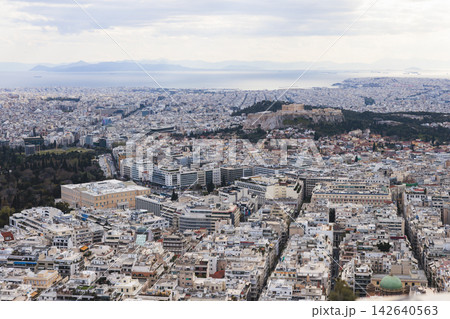 Athens, Attica, Greece, beautiful panoramic view of Athens cityscape, with The Parthenon, mountains, sea and scenery beyond the city, seen from Mount Lycabettus Hill observation deck in a sunny day Athens, Attica, Greece, beautiful panoramic view of Athens cityscape, with The Parthenon, mountains, sea and scenery beyond the city, seen from Mount Lycabettus Hill observation deck in a sunny day 142640563