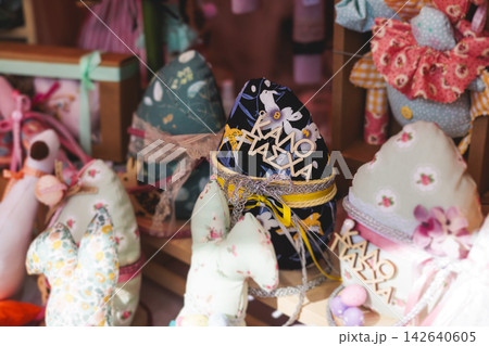 Easter in Greece, caffe and shop decorations, bunnies, multicoloured easter eggs, decorated shopwindow, Easter gifts and souvenirs, showcase, glass case, shopfront decorated in Athens, Attica, Greece 142640605