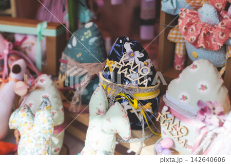 Easter in Greece, caffe and shop decorations, bunnies, multicoloured easter eggs, decorated shopwindow, Easter gifts and souvenirs, showcase, glass case, shopfront decorated in Athens, Attica, Greece 142640606
