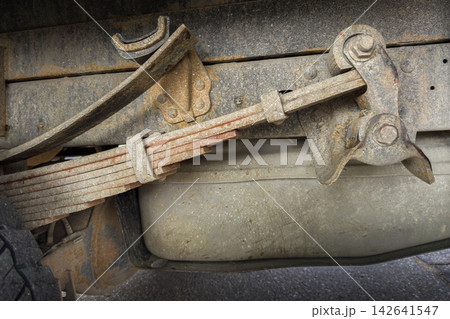 Rusty leaf spring suspension on a truck Rusty leaf spring suspension on a truck 142641547