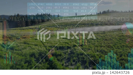 Spraying pivot irrigation arm emitting fine mist over crop rows at farm, with digital overlays Spraying pivot irrigation arm emitting fine mist over crop rows at farm, with digital overlays 142643726