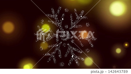 Sparkling centered snowflake glowing on dark maroon backdrop, with warm bokeh orbs, star sparks 142643789