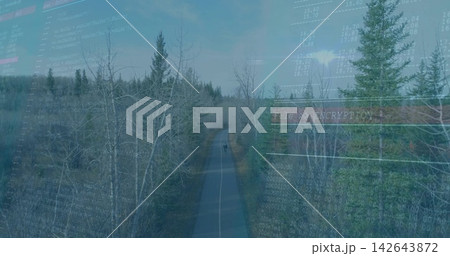 Cycling teen male riding bike down paved trail through trees, wearing helmet, ENCRYPTION overlay 142643872
