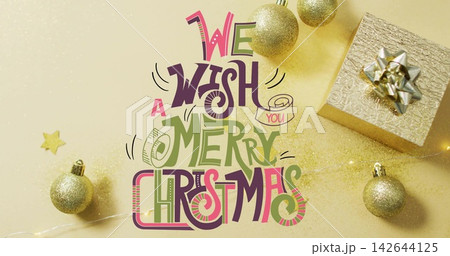 Vertical video: Lettering glowing as fairy lights activating glitter across baubles for card design Vertical video: Lettering glowing as fairy lights activating glitter across baubles for card design 142644125