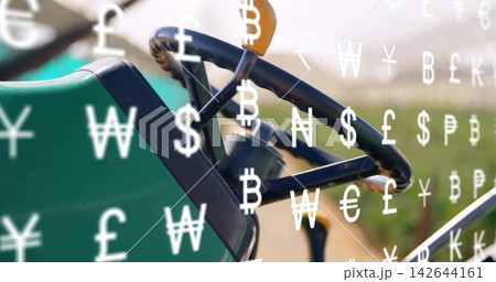 Displaying black 3-spoke wheel with gear lever and dash on field with green-seat, currency symbols 142644161