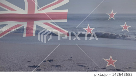 Showing faint New Zealand flag overlay over shore, revealing wet sand, footprints and waves Showing faint New Zealand flag overlay over shore, revealing wet sand, footprints and waves 142648682