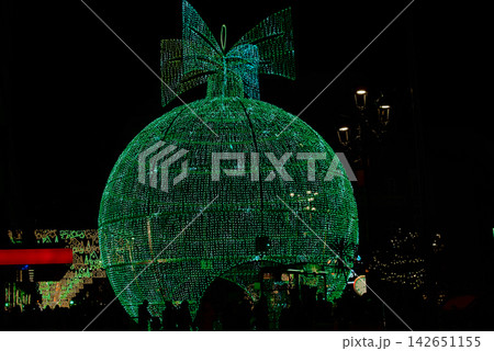Gigantic illuminated Christmas sphere attracting tourists at night in the center of Vigo Gigantic illuminated Christmas sphere attracting tourists at night in the center of Vigo 142651155