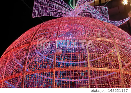 Gigantic illuminated Christmas sphere attracting tourists at night in the center of Vigo Gigantic illuminated Christmas sphere attracting tourists at night in the center of Vigo 142651157