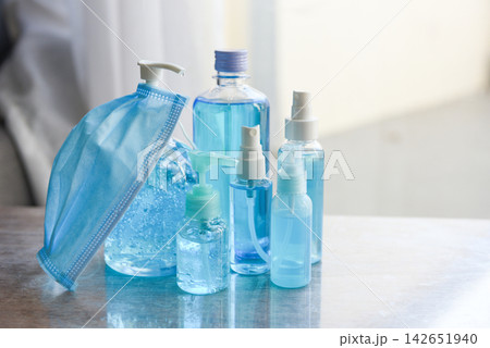 Face mask and product clean disinfectant kill virus bacteria germs hand sanitizer bottle gel for washing hands hygiene with alcohol gel and antibacterial soap sanitizer coronavirus prevention outbreak Face mask and product clean disinfectant kill virus bacteria germs hand sanitizer bottle gel for washing hands hygiene with alcohol gel and antibacterial soap sanitizer coronavirus prevention outbreak 142651940