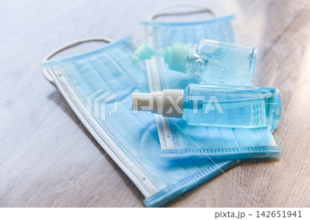 Face mask and product clean disinfectant kill virus bacteria germs hand sanitizer bottle gel for washing hands hygiene with alcohol gel and antibacterial soap sanitizer coronavirus prevention outbreak Face mask and product clean disinfectant kill virus bacteria germs hand sanitizer bottle gel for washing hands hygiene with alcohol gel and antibacterial soap sanitizer coronavirus prevention outbreak 142651941