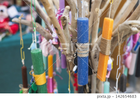 Greek Easter candles, assortment selection of handmade crafted traditional lambada, multicoloured wax candles with ribbon for sale in local store market, Orthodox Easter traditions in Athens, Greece 142654683