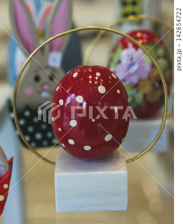 Easter in Greece, caffe and shop decorations, bunnies, multicoloured easter eggs, decorated shopwindow, Easter gifts and souvenirs, showcase, glass case, shopfront decorated in Athens, Attica, Greece Easter in Greece, caffe and shop decorations, bunnies, multicoloured easter eggs, decorated shopwindow, Easter gifts and souvenirs, showcase, glass case, shopfront decorated in Athens, Attica, Greece 142654722