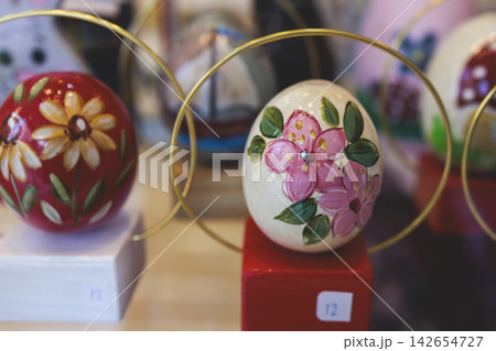Easter in Greece, caffe and shop decorations, bunnies, multicoloured easter eggs, decorated shopwindow, Easter gifts and souvenirs, showcase, glass case, shopfront decorated in Athens, Attica, Greece Easter in Greece, caffe and shop decorations, bunnies, multicoloured easter eggs, decorated shopwindow, Easter gifts and souvenirs, showcase, glass case, shopfront decorated in Athens, Attica, Greece 142654727