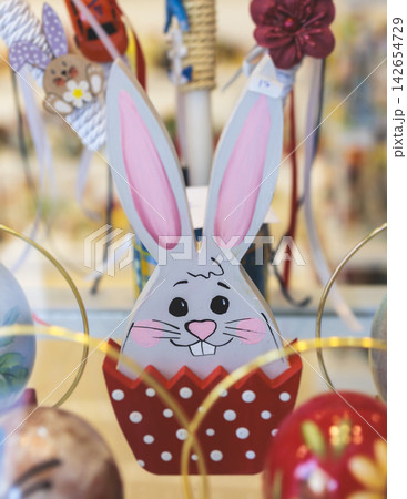 Easter in Greece, caffe and shop decorations, bunnies, multicoloured easter eggs, decorated shopwindow, Easter gifts and souvenirs, showcase, glass case, shopfront decorated in Athens, Attica, Greece 142654729