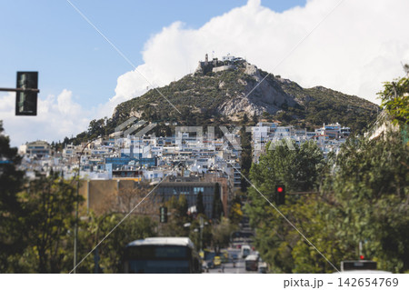 Mount Lycabettus, Athens, Greece, hiking and climbing to Lycabettos hill and Holy Church of Saint George of Lycabettus, Attica, Athens cityscape panorama view in sunny day, Lykavittos Greek landscape Mount Lycabettus, Athens, Greece, hiking and climbing to Lycabettos hill and Holy Church of Saint George of Lycabettus, Attica, Athens cityscape panorama view in sunny day, Lykavittos Greek landscape 142654769