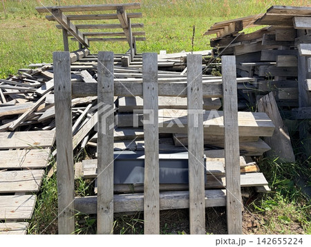 a large pile of wooden construction waste on a suburban site a large pile of wooden construction waste on a suburban site 142655224