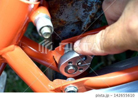 Bicycle repair with a ratchet wrench. Bicycle repair with a ratchet wrench. 142655610