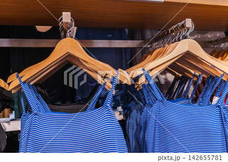 Blue and White Striped Garments on Retail Clothing Rack Blue and White Striped Garments on Retail Clothing Rack 142655781