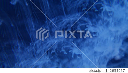 Defocused blue smoke. Cloud fume paint. Vibrant acrylic color haze mist rainbow pigment bright texture spreading on abstract background. Defocused blue smoke. Cloud fume paint. Vibrant acrylic color haze mist rainbow pigment bright texture spreading on abstract background. 142655937