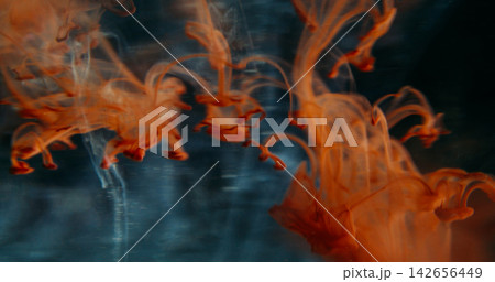 Blur ink wave. Smoke water. Blue color pigment haze fume acrylic texture gleam orange cascade droplets spreading on abstract art background. Blur ink wave. Smoke water. Blue color pigment haze fume acrylic texture gleam orange cascade droplets spreading on abstract art background. 142656449