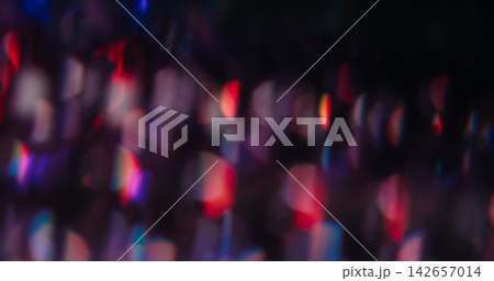 Blur color flare. Light spots. Defocused red blue purple radiant optical neon flash on abstract illuminated creative dark black background. Blur color flare. Light spots. Defocused red blue purple radiant optical neon flash on abstract illuminated creative dark black background. 142657014