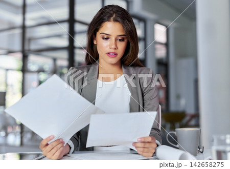 Business, woman and reading documents in office for proposal, startup project and corporate report. Workplace, professional and hr manager with paperwork to check, analyse and company information Business, woman and reading documents in office for proposal, startup project and corporate report. Workplace, professional and hr manager with paperwork to check, analyse and company information 142658275