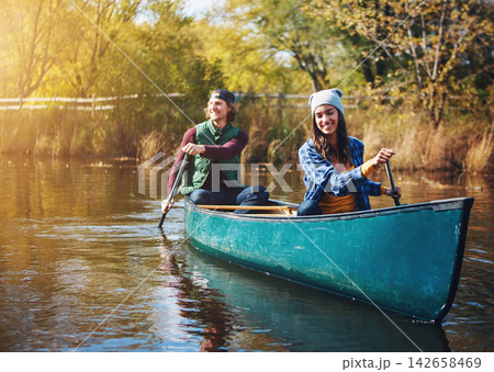 Outdoor, happy and couple in kayak on lake for adventure, holiday and vacation in nature. Travel, morning and man with woman in canoe, raft and rowing for water activity, hobby and bonding on weekend Outdoor, happy and couple in kayak on lake for adventure, holiday and vacation in nature. Travel, morning and man with woman in canoe, raft and rowing for water activity, hobby and bonding on weekend 142658469