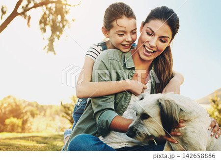 Outdoor, mother and girl with dog, smile and sunshine with weekend break, happiness and countryside. Family, park or mama with daughter, animal or pet with lens flare, care or summer with play or fun 142658886