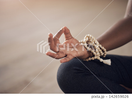 Hand, person and bracelet with gyan mudra in yoga class for zen, meditation and chakra in studio. Woman, harmony and sitting on floor for peace, calmness and concentration for healthcare or wellbeing Hand, person and bracelet with gyan mudra in yoga class for zen, meditation and chakra in studio. Woman, harmony and sitting on floor for peace, calmness and concentration for healthcare or wellbeing 142659026