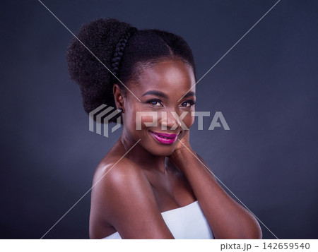 African woman, beauty and makeup in studio with happy face for confidence and cosmetics on a gray background. Portrait of young model with skincare, dermatology and foundation for cosmetology results African woman, beauty and makeup in studio with happy face for confidence and cosmetics on a gray background. Portrait of young model with skincare, dermatology and foundation for cosmetology results 142659540