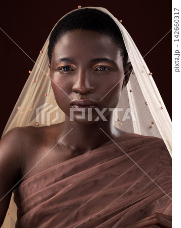 African, portrait or woman with makeup, scarf or confidence glow in studio on black background. Beauty, face or proud model with traditional wrap, eyeshadow cosmetics or creative fashion in Nigeria African, portrait or woman with makeup, scarf or confidence glow in studio on black background. Beauty, face or proud model with traditional wrap, eyeshadow cosmetics or creative fashion in Nigeria 142660317