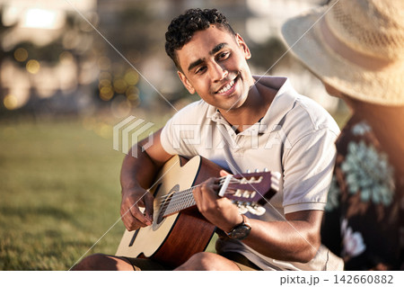 Picnic, date and man with instrument for romance, love and anniversary in Puerto Rico. Couple, happy and music in outing on grass for summer, relax or happiness together at sunset with guitar in park Picnic, date and man with instrument for romance, love and anniversary in Puerto Rico. Couple, happy and music in outing on grass for summer, relax or happiness together at sunset with guitar in park 142660882