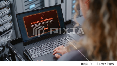 Female Professional Investigating Cyber Attack Alert Through Linux CLI in Modern Data Center 142661469